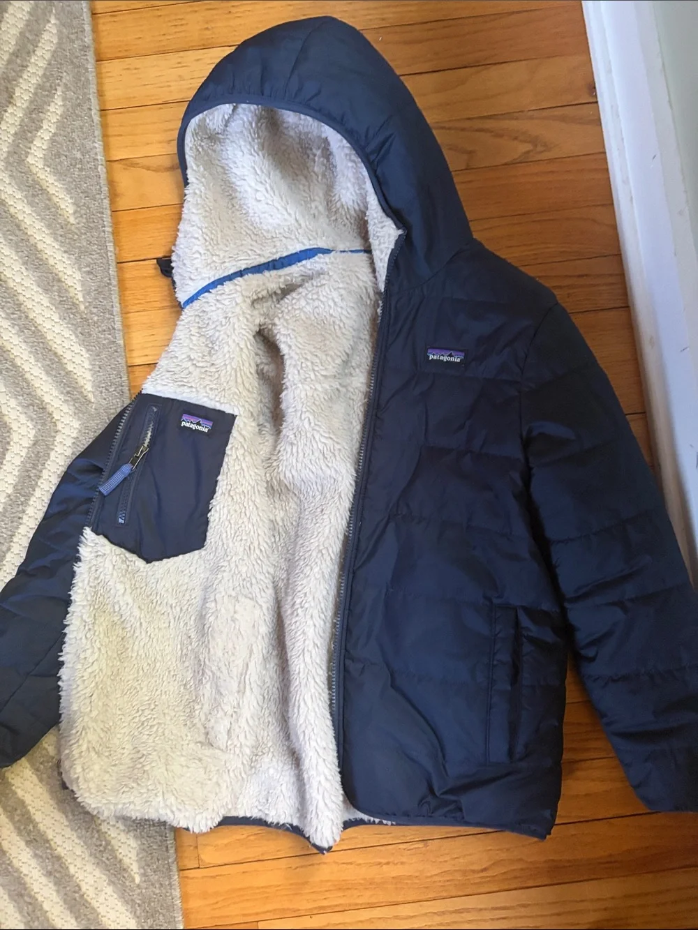 Patagonia Men’s Hooded Puffer Jacket in Navy with Cream Sherpa Lining